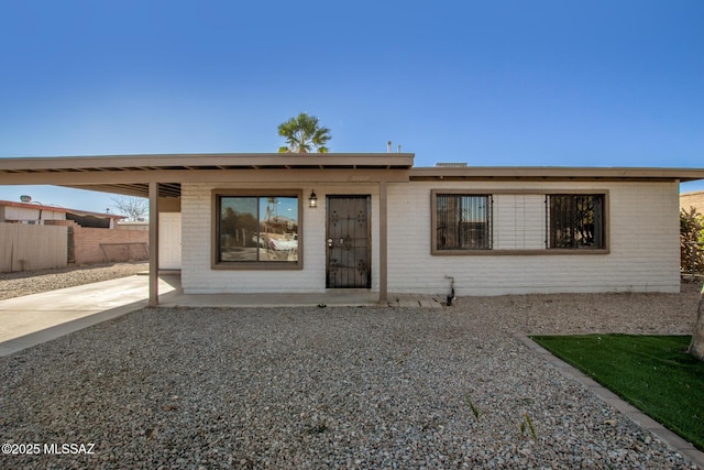 ranch-style house with a carport