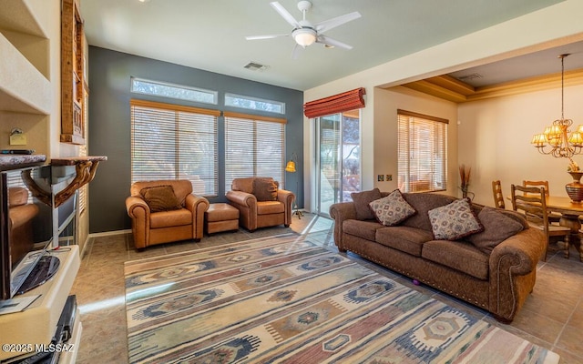 living room featuring ceiling fan with notable chandelier