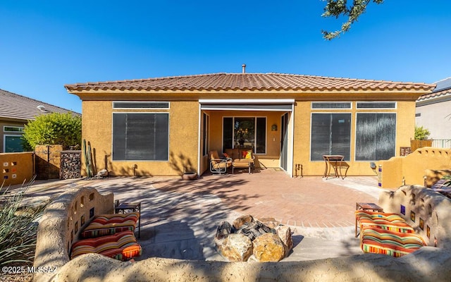 rear view of house featuring a patio