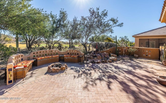 view of patio / terrace with a fire pit