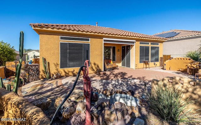 rear view of property featuring a patio