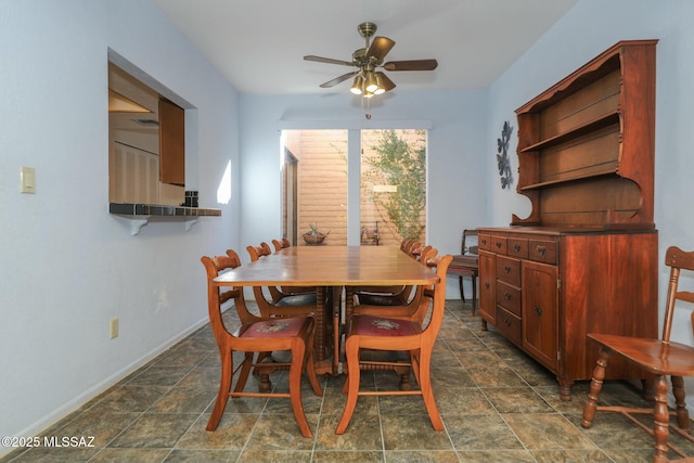 dining space with ceiling fan