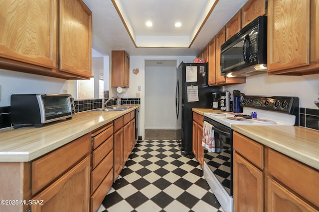 kitchen featuring black appliances and sink