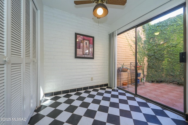 interior space featuring brick wall