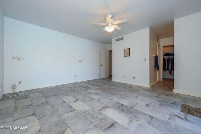 empty room featuring ceiling fan