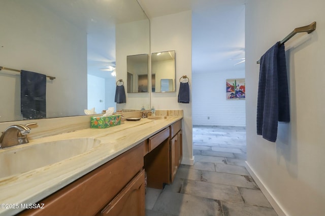 bathroom featuring ceiling fan and vanity