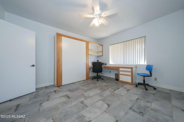 unfurnished office with ceiling fan