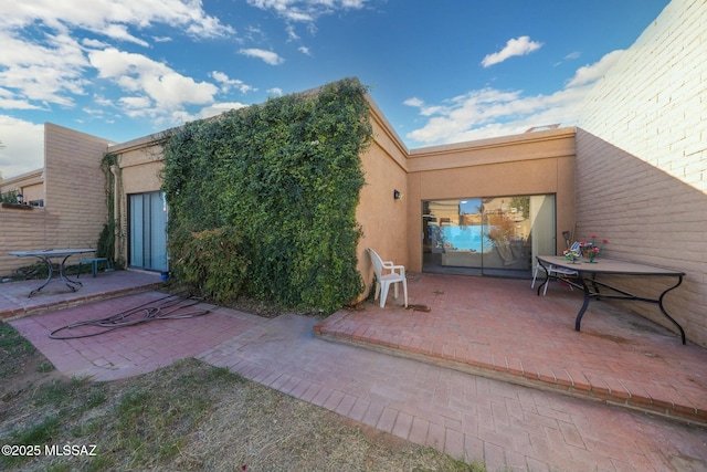 back of house with a patio area