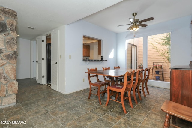 dining space with ceiling fan