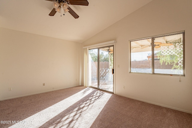 empty room with lofted ceiling, carpet floors, and ceiling fan