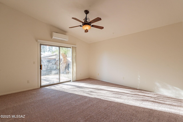 empty room featuring vaulted ceiling, carpet floors, ceiling fan, and a wall mounted air conditioner