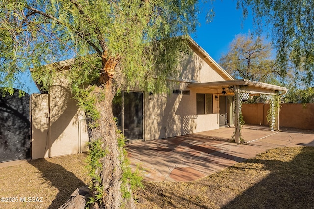 back of property featuring a patio