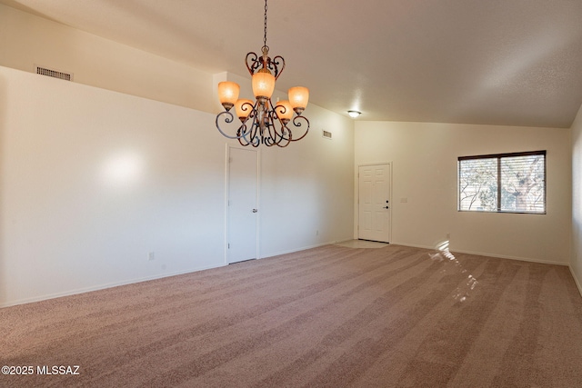 unfurnished room with lofted ceiling, carpet floors, and a notable chandelier