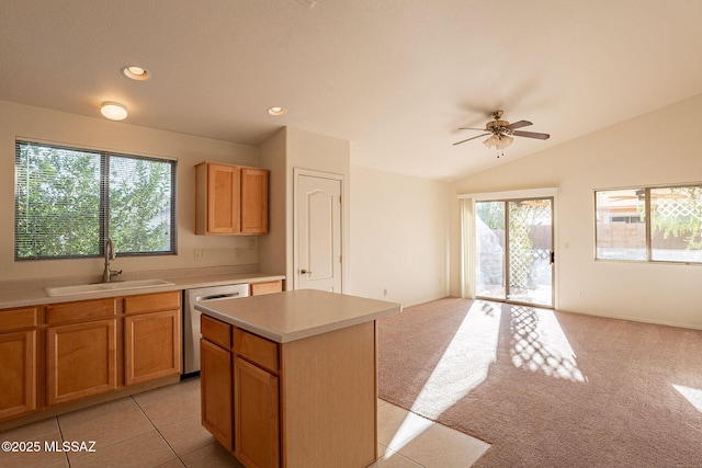 kitchen with dishwasher, a center island, lofted ceiling, ceiling fan, and sink