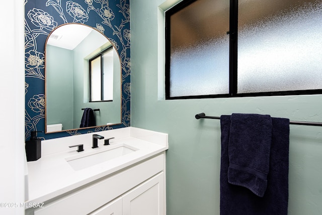 bathroom with vanity and toilet