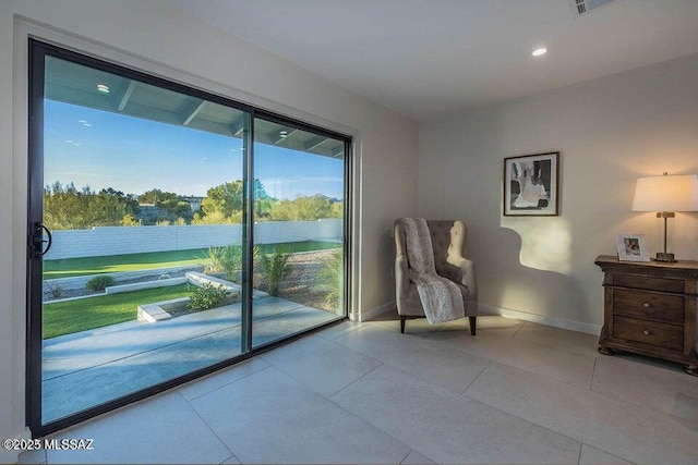 doorway featuring light tile patterned flooring and a healthy amount of sunlight