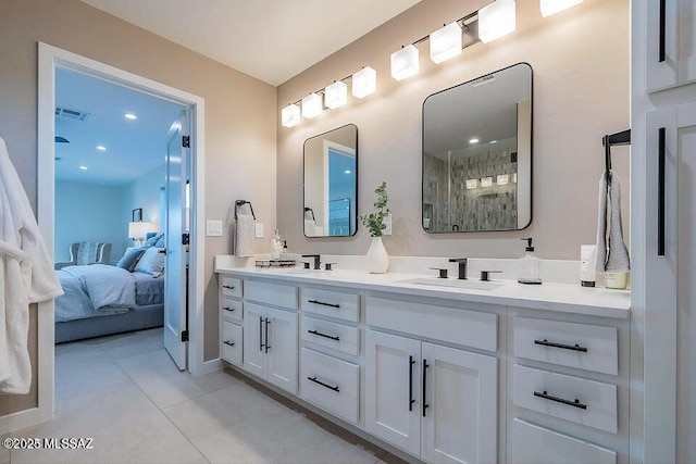 bathroom featuring tile patterned flooring and vanity