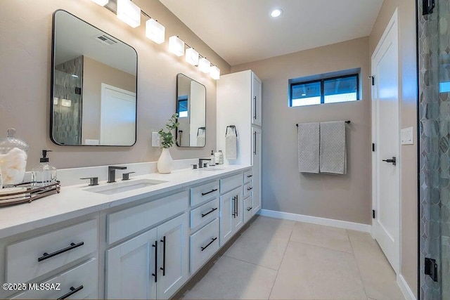 bathroom featuring vanity, an enclosed shower, and tile patterned flooring