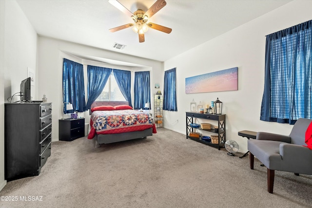 carpeted bedroom featuring ceiling fan