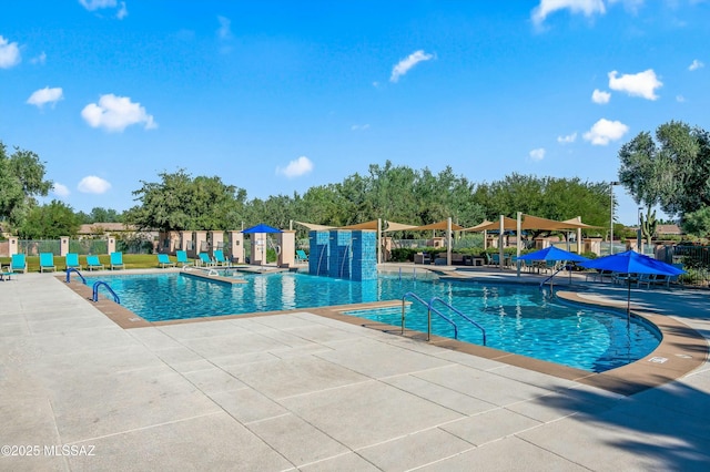 view of swimming pool with a patio area