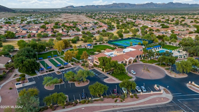 birds eye view of property with a mountain view