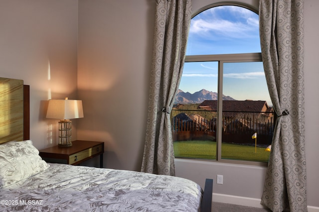 bedroom featuring a mountain view