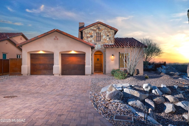 mediterranean / spanish-style house featuring a garage