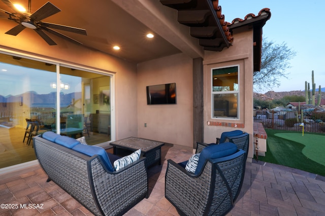 view of patio featuring ceiling fan and outdoor lounge area