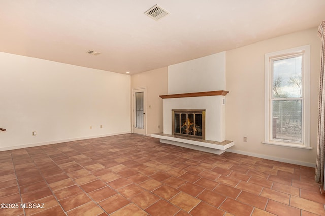 unfurnished living room with tile patterned floors