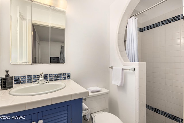 bathroom featuring toilet, vanity, radiator, and curtained shower