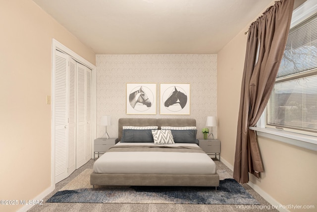 carpeted bedroom with a closet