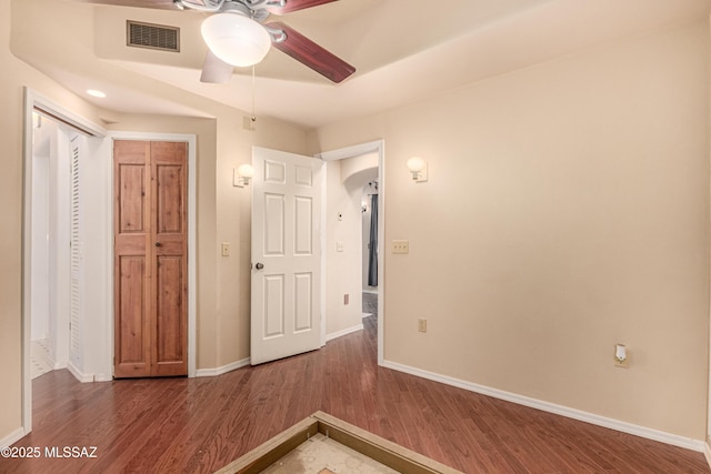 unfurnished bedroom featuring ceiling fan and hardwood / wood-style floors