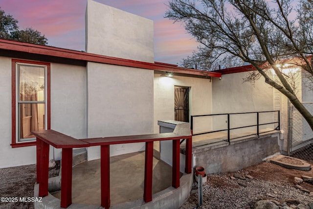 view of property exterior at dusk