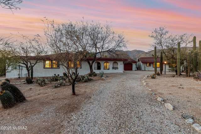 view of front of house featuring a mountain view and a garage