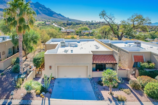 birds eye view of property featuring a mountain view