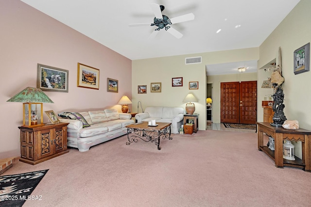 living room with light colored carpet and ceiling fan