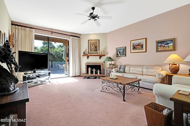 carpeted living room with ceiling fan and a brick fireplace