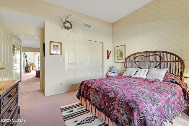 carpeted bedroom with a closet