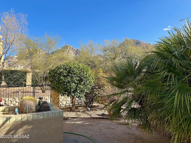 view of patio / terrace featuring a mountain view