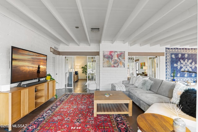 living room with beamed ceiling and dark hardwood / wood-style flooring