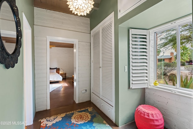 hallway featuring an inviting chandelier