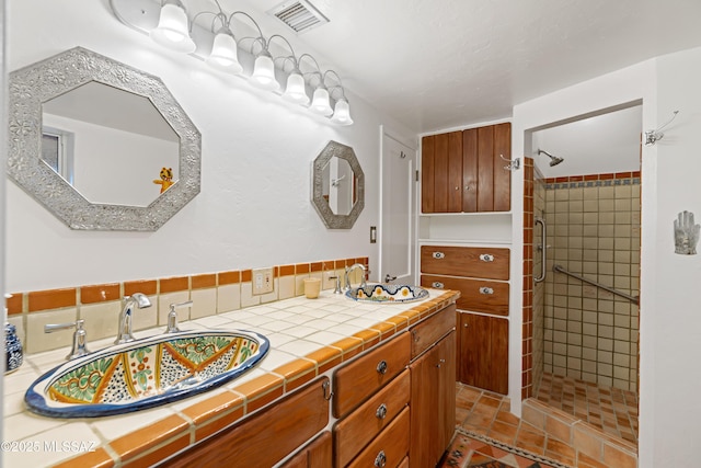 bathroom featuring vanity and walk in shower