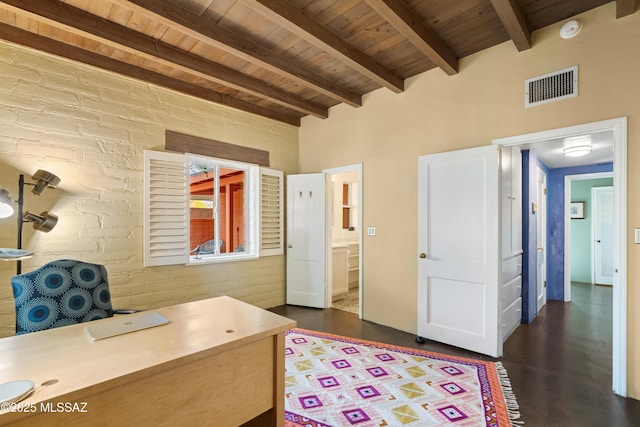 home office with beamed ceiling, brick wall, and wooden ceiling