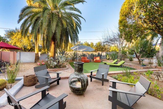 view of patio with an outdoor fire pit