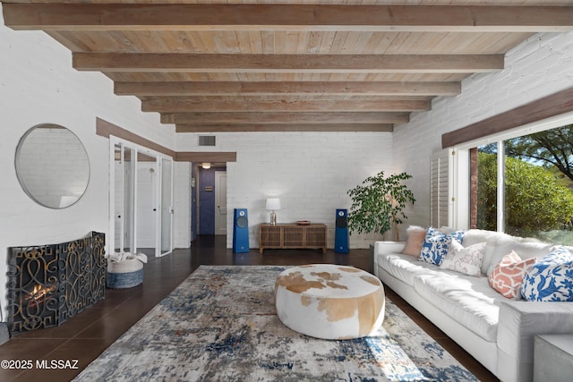 living room featuring wood ceiling, a fireplace, and beamed ceiling