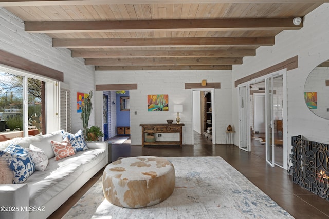 living room featuring beam ceiling and wooden ceiling