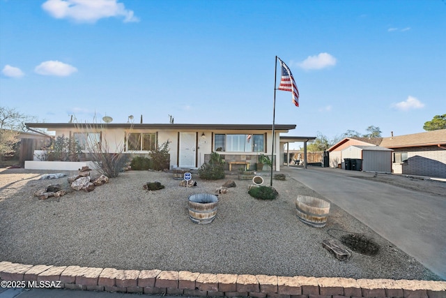 ranch-style house featuring a carport