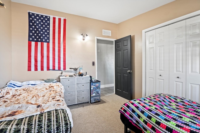 carpeted bedroom with a closet