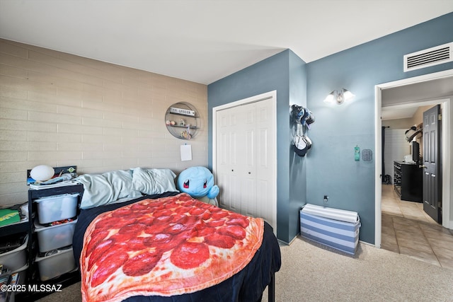 carpeted bedroom featuring a closet