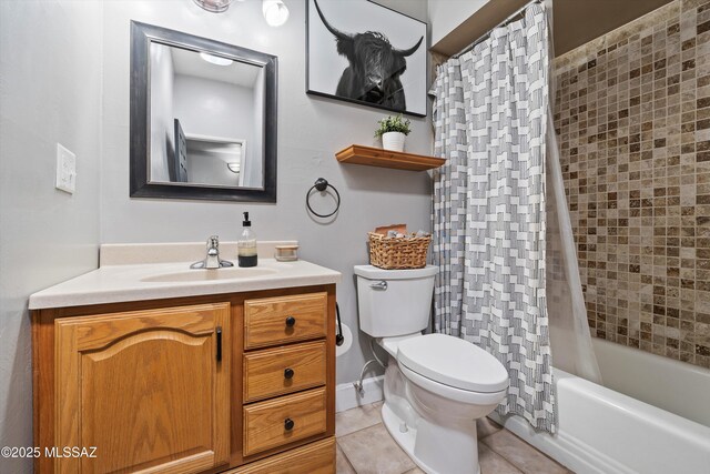 full bathroom featuring toilet, vanity, tile patterned floors, and shower / bathtub combination with curtain